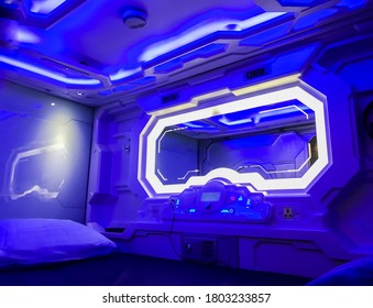 Moscow, Russia, March 2019: Capsule Hotel. Sleeping Pod Interior: A Place To Sleep With A Pillow, Mirror, Control Panel On The Wall