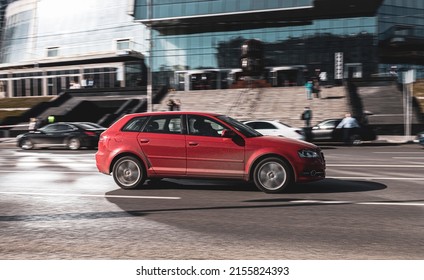 Moscow, Russia - March 2022: Audi A3 Moving On The City Road. Red Audi A3 Hatchback Car Is Driving On The Street