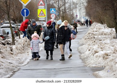 Moscow, Russia - March 2022: People Walking With Children In City. Families At Walk At Early Spring