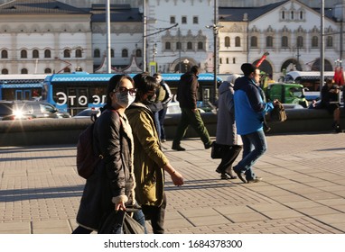 Moscow, Russia - March 26,2020: Very Few People Wearing Protection Masks On The Streets Of Russian Megapolis As Coronavirus/covid-19 Rapidly Spreads Among Population. Social Distancing Concept Fails. 