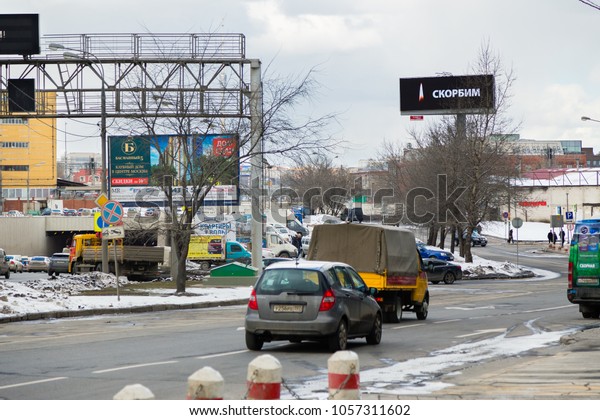 MOSCOW, RUSSIA - MARCH 28, 2018: The inscription\
MOURNING with burning candle flame in memory of the victims of a\
fire in Kemerovo on a large LED advertising billboard near the\
shopping mall TROIKA