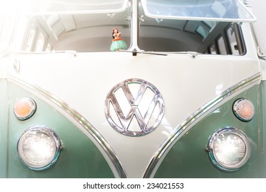 Moscow, Russia - March 3, 2013: Front view of a green and white 1960s VW campervan with the iconic volkswagen badge and double windshield.
