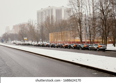 Moscow, Russia - March 31, 2020: An Empty Street In Levoberezhniy District With A Lot Of Unused Car Sharing Delimobil On It With The Covid Pandemic Happening. Empty Street.