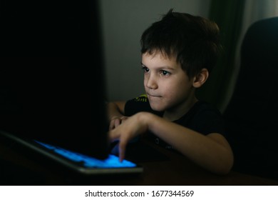 Moscow, Russia, March 4, 2020 ,child Boy Plays Computer Games In A Dark Room