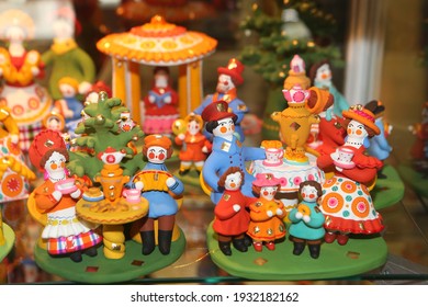 MOSCOW, RUSSIA - MARCH 6, 2021: Ancient Russian Traditional National Handcraft, Handicraft: Old Dymkovo Clay Toy, Doll: People In Russian Style. Dymkovo Souvenir From Russia. Folk Art, Ethnic Culture