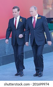 MOSCOW, RUSSIA - MAY 09, 2014: Celebration Of The 69th Anniversary Of The Victory Day (WWII) On Red Square. President Vladimir Putin And Prime Minister Dmitry Medvedev Came To The Ceremony