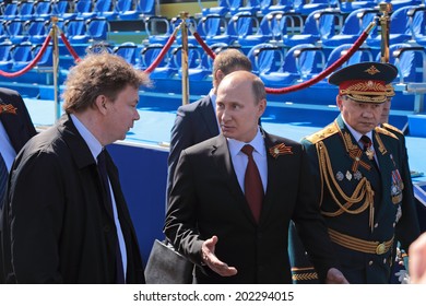 MOSCOW, RUSSIA- MAY 09, 2014: Celebration Of Anniversary Of The Victory Day (WWII) On Red Square. President Vladimir Putin And Minister Of Defense Sergey Shoygu At The Victory Parade On The Red Square