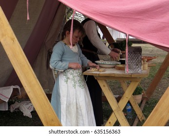  Moscow . Russia. May 1, 2017. Kolomenskoye Park. The St George Tournament. Camp Of Tournament Participants. Young Girl And Her Mum Are Cooking Pasta For A Dinner.                              