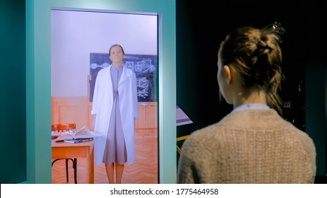 MOSCOW, RUSSIA - MAY 1, 2019: Modern Museum. Woman Watching Educational Video Presentation On Display Of Interactive Kiosk. Education, Science And Learning Concept