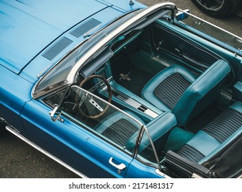 MOSCOW, RUSSIA - MAY 15, 2022: Top view of a 1966 Ford Mustang convertible with an open roof, blue, parked at a retro car exhibition. Blue Ford convertible top view.