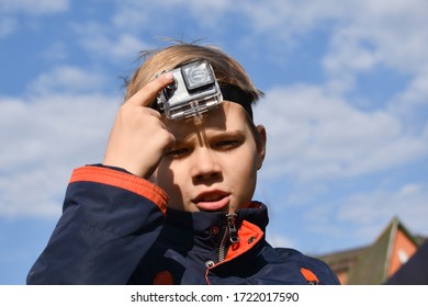 Moscow. Russia. May 2020. Boy With Action Camera On The Head. Amateur Video. The Child Blogger.