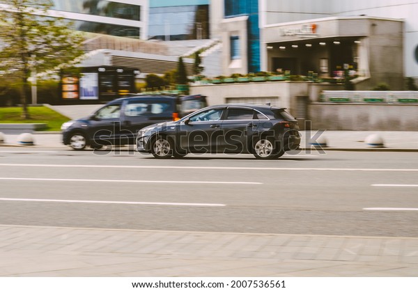 Moscow, Russia - May, 2021:\
Kia Ceed on the city road. Fast moving black shiny korean car on\
the street. Vehicle driving along the street in city with blurred\
background.