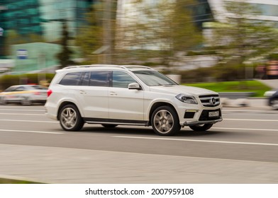 Moscow, Russia - May 2021: Mercedes GL Class X166 In The City Street. Urban Scene With Vehicle Riding Fast And Blurred Background. Side View Of Premium German SUV In Motion