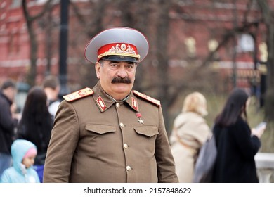 Moscow, Russia - May 2022: Man In Stalin Costume Standing On Street In Crowd Of People. Red Square, Travel In Russia, USSR History