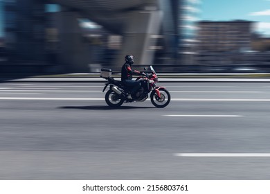 Moscow, Russia - May 2022: Side View Of Man In Helmet Riding Honda Africa Twin Motorbike CRF1100L On City Road