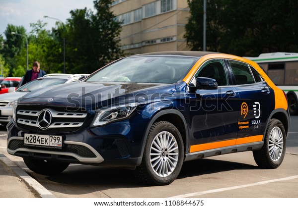 MOSCOW, RUSSIA - May 23, 2018: A car Mercedes\
Benz car sharing company Belka car is available for rent. Rental\
car share is popular in Moscow also because they can park for free\
on toll parking.