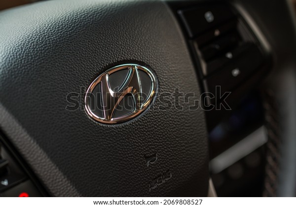 MOSCOW, RUSSIA - MAY 23, 2021\
Hyundai company logo close-up view on the steering wheel. Logo of\
the South Korean multinational automotive manufacturer\
Hyundai.