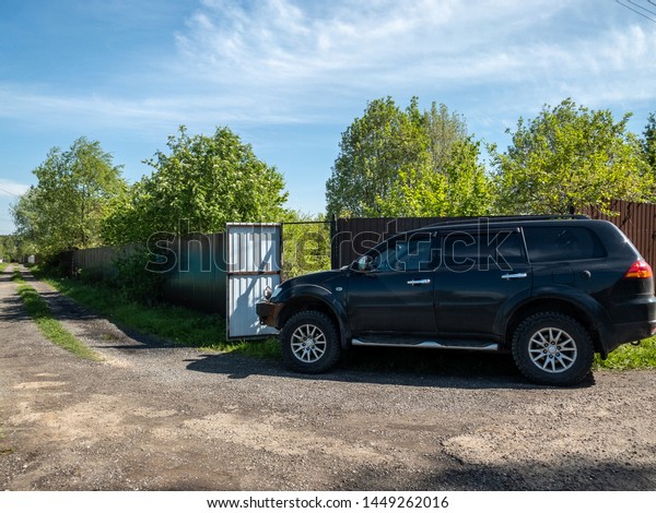 Moscow,
Russia - May 24, 2019: Black off-road car Mitsubishi Pajero Sport
SUV parked near the fence of a country
house