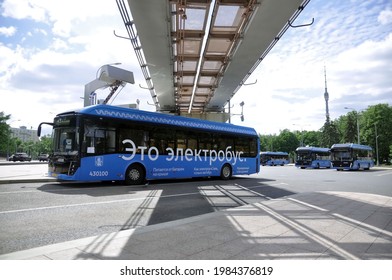 Moscow, Russia - May 30, 2021: Electric Bus At The Charging Station During Recharging. Eco-friendly Urban Public Transport Of The Future.