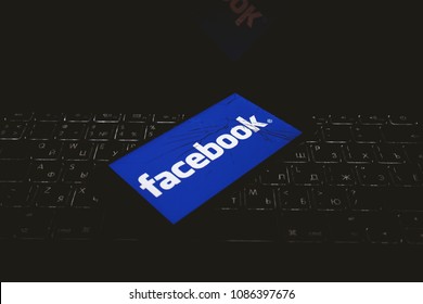 Moscow, Russia - May, 8 2018: The logo of Facebook is displayed on a smartphone with splintered glass.