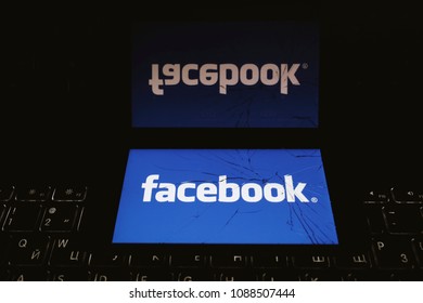 Moscow, Russia - May, 8 2018: The logo of Facebook is displayed on a smartphone with splintered glass.