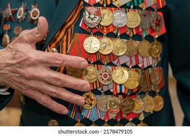 Moscow, Russia - May 8, 2022. Military awards on the chest of an elderly veteran. Old soldier with a lot of medals and orders. Hero of the Great Patriotic War. The Second World War. 