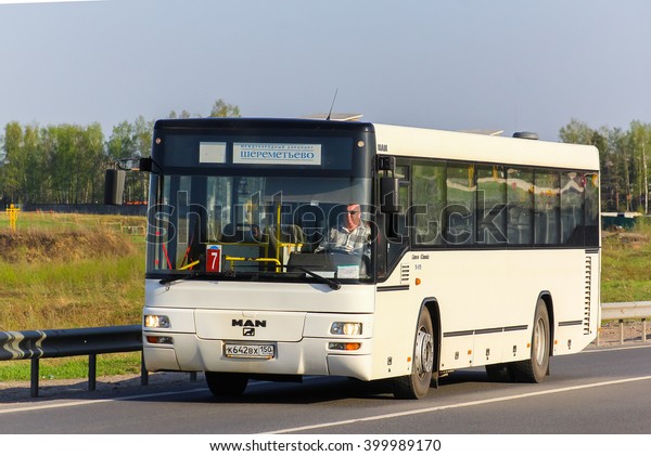 MOSCOW, RUSSIA - MAY 9, 2013: White\
suburban bus MAN A74 Lion\'s Classic at the intercity\
road.
