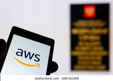 MOSCOW, RUSSIA - MAY 9, 2018: Smartphone In Hand With Amazon Web Services (AWS) Logo. Roskomnadzor (RKN) Office On Background. Millions Of IP Was Blocked To Ban Telegram App Messenger. Censorship. VPN
