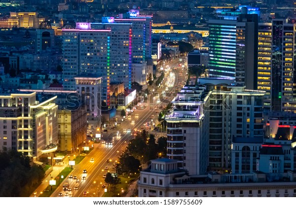 Moscow. Russia. Multi-lane road. Night Moscow
view from above. Cars rides through the evening city. Road
architecture of Russia. Lights of the night city. Russia region.
Tour Russian Federation