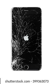 Moscow, Russia - November 22, 2015: Photo of iPhone 6 plus with broken display. Modern smartphone with damaged glass screen isolated on white background. Device needs repair.