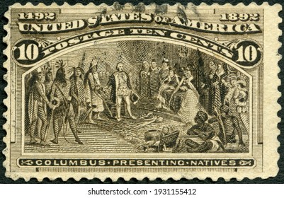 MOSCOW, RUSSIA - OCTOBER 09, 2020: A Stamp Printed In USA Shows Christopher Columbus (1450-1506), Columbus Presenting Natives, Columbian Exposition Issue, 1892