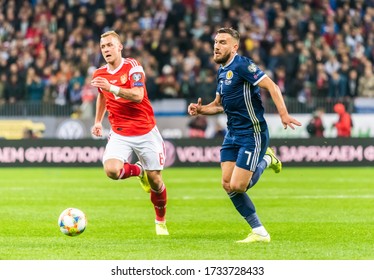 Moscow, Russia – October 10, 2019. Scotland Midfielder Robert Snodgrass And Russia Player Dmitri Barinov During UEFA Euro 2020 Qualification Match Russia Vs Scotland (4-0) In Moscow.