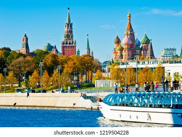 MOSCOW, RUSSIA - OCTOBER 13, 2018:   Spasskaya Tower and Cathedral of Vasily the Blessed (Saint Basil's Cathedral) on Red Square and Radisson Royal Flotilla yacht on Moskva-river in sunny autumn day - Shutterstock ID 1219504228