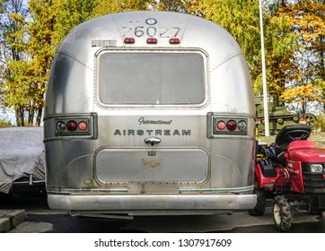MOSCOW, RUSSIA - October 13, 2018: luxury American Airstream caravan parked on gravel on a campsite.