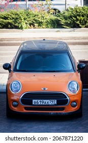 Moscow, Russia - October  15, 2021:Orange Mini Cooper   Is Parked  On The Street On A Warm  Autumn  Day , Top View 