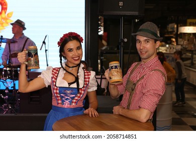 MOSCOW, RUSSIA – OCTOBER 16, 2021: Traditional national Bavarian dances. Oktoberfest festival in Privoz Foodmall Moscow city, Russia. "Bavarian Carousel" band. Folk music, dance. German dancer. Yodel