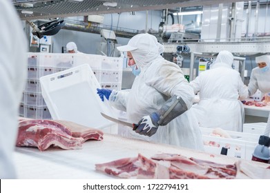 Moscow, Russia. October 17, 2017. Meat Processing Plant. Worker In The Process Of Cutting Pork Meat.