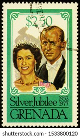 Moscow, Russia - October 17, 2019: Stamp Printed In Grenada Shows Queen Elizabeth II And Prince Philip Duke Of Edinburgh, Series 