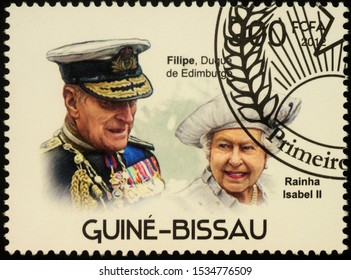 Moscow, Russia - October 18, 2019: Stamp Printed In Guinea-Bissau Shows Queen Elizabeth II And Prince Philip, Series 