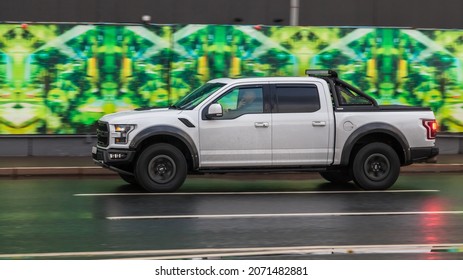 Moscow, Russia - October 2021: Ford F-150 Limited SuperCrew Pickup Truck Driving On The Highway On High Speed. Wet And Slippery Asphalt After Rain