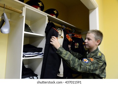 MOSCOW, RUSSIA - OCTOBER 24,2013:Cadet At The Wardrobe In The Cadet Corps Of The Police.Cadet Corps - Initial Military Training School With The Full Board To Prepare Youth For A Military Career.