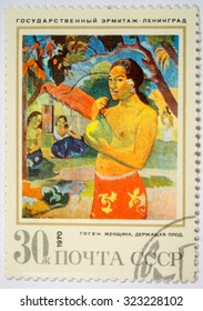 Moscow, Russia - October 3, 2015: A stamp printed in the USSR shows a painting "Woman with Fruit" by Gauguin from the series "Foreign Paintings in Hermitage, Leningrad", circa 1970