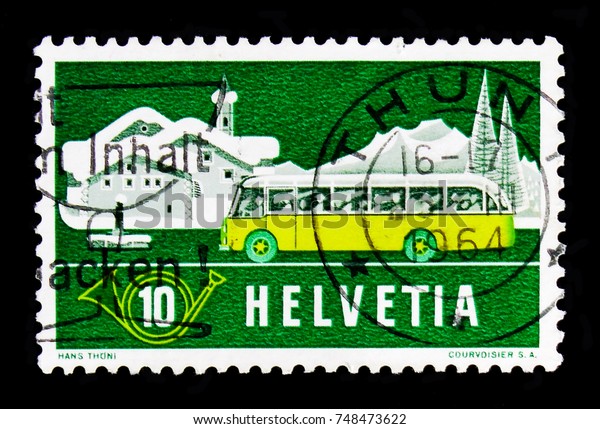 MOSCOW, RUSSIA - OCTOBER 3, 2017: A stamp printed in\
Switzerland shows Post in summer landscape (Graubunden), Post in\
the Alps serie, circa\
1953