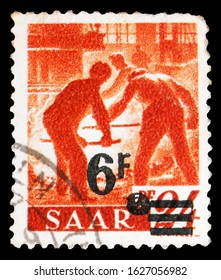 MOSCOW, RUSSIA - OCTOBER 7, 2019: Postage stamp printed in Germany, Saarland, shows Furnace workers, Professions and views of Saarland serie, 6 F - French franc, circa 1947