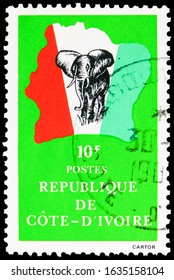 MOSCOW, RUSSIA - OCTOBER 8, 2019: Postage Stamp Printed In Cote D'Ivoire Shows Elephant In Front Of Map Of Ivory Coast, Country Symbol Serie, Circa 1984