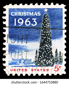 MOSCOW, RUSSIA - OCTOBER 8, 2019: Postage Stamp Printed In United States Shows National Christmas Tree And White House, Christmas Serie, Circa 1963