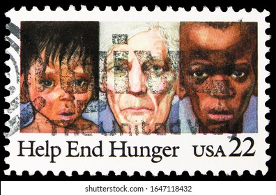 MOSCOW, RUSSIA - OCTOBER 8, 2019: Postage Stamp Printed In United States Shows Youths And Elderly Suffering From Malnutrition, Help End Hunger Serie, Circa 1985