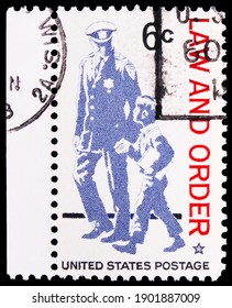 MOSCOW, RUSSIA - OCTOBER 8, 2020: Postage Stamp Printed In United States Shows Policeman And Boy, Law And Order Issue Serie, Circa 1968