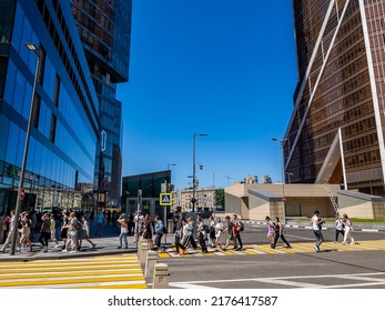 Moscow, Russia, On July 3, 2022. Urban View. Pedestrians Go Across The Road Near Skyscrapers Of Moscow City Area 