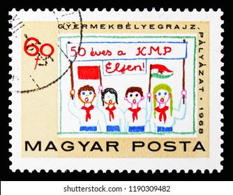 MOSCOW, RUSSIA - SEPTEMBER 15, 2018: A Stamp Printed In Hungary Shows Children With Banner And Flags, Hungarian Communist Party Serie, Circa 1968